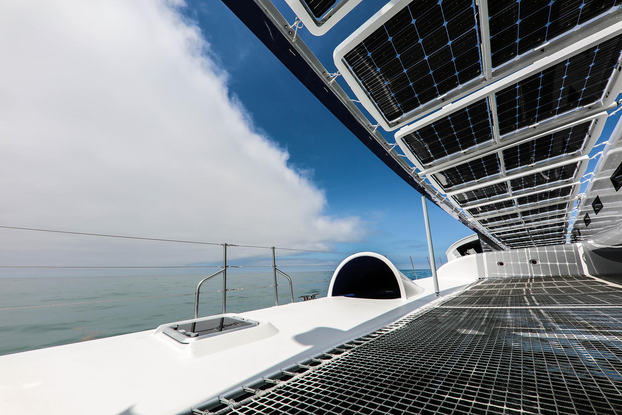 Double-sided, or bifacial, solar panels can use the sunlight reflected from the water as well as that shining down from above to produce energy. Image credit - Jérémy Bidon/ Energy Observer