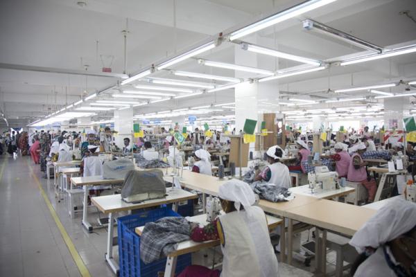 Developing countries such as Bangladesh can protect themselves from shocks by exporting textiles and other products. Image credit: ‘NASSA Group AJ Super Garments LTD. RMG production line’ by Musamir Azad is licensed under Creative Commons Attribution-SA 3.0 