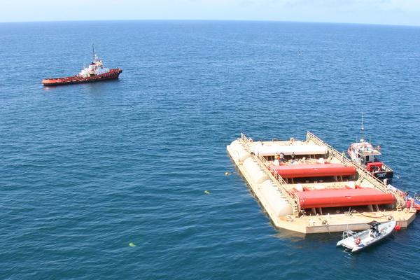 The WaveRoller is taken out to sea on a barge and will sit at the bottom of the ocean and harness wave energy to produce electricity. Image courtesy of WaveRoller