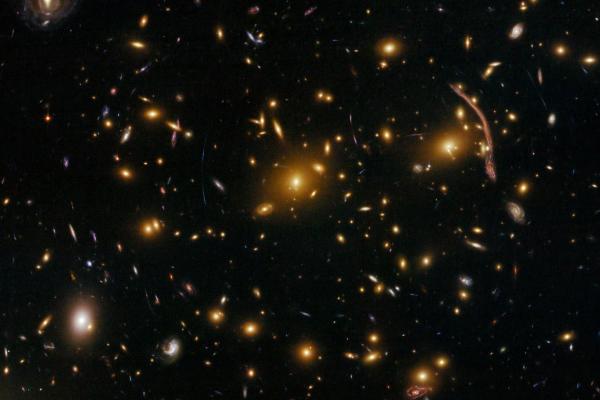 Gravitational lensing in galaxy clusters such as Abell 370 are helping scientists to measure the dark matter distribution. Image credit - NASA, ESA, the Hubble SM4 ERO Team and ST-ECF
